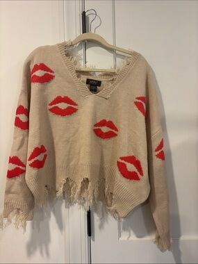 Distressed Beige V-Neck Sweater with Red Lip Motif